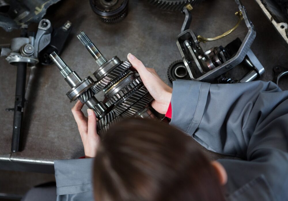 female-mechanic-holding-spare-parts
