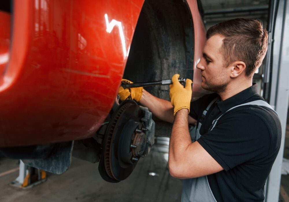 fixing-breaks-man-in-uniform-is-working-in-the-auto-service.jpg